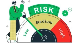 A person standing near the risk meter to identify the seriousness of cyber threats amongst low, medium and high, representing dark web monitoring process of Mitigata.